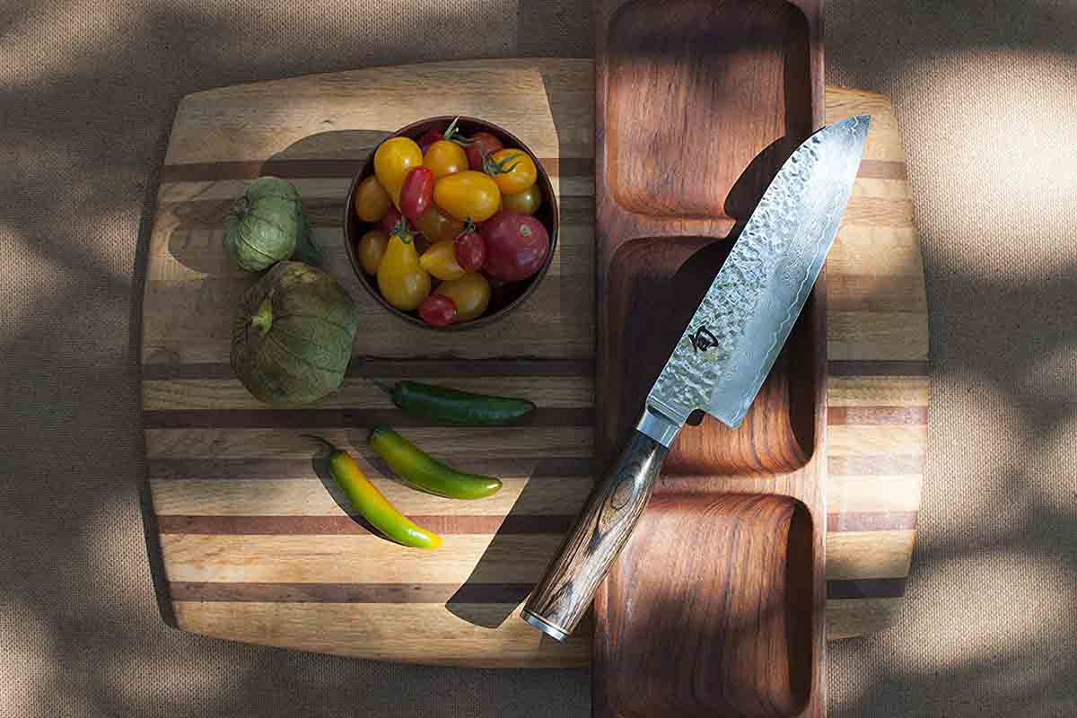 Shun Premier Santoku 7-inch quality Chef's Knife on a board