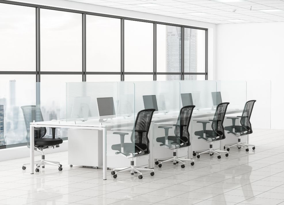 desk with four chairs and desk dividers