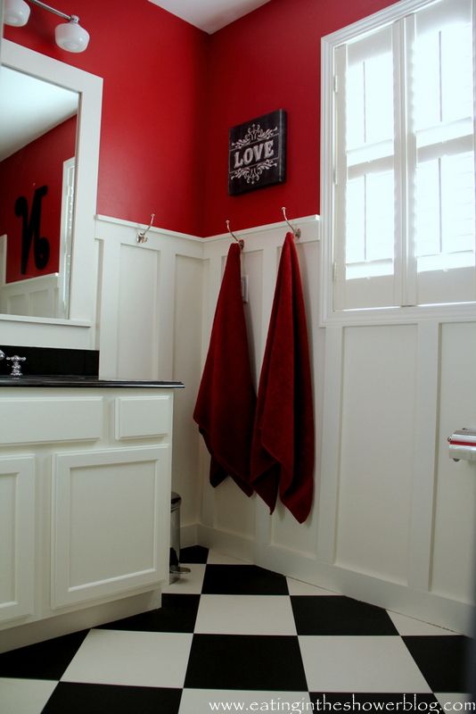 red color paint and black and white tile bathroom