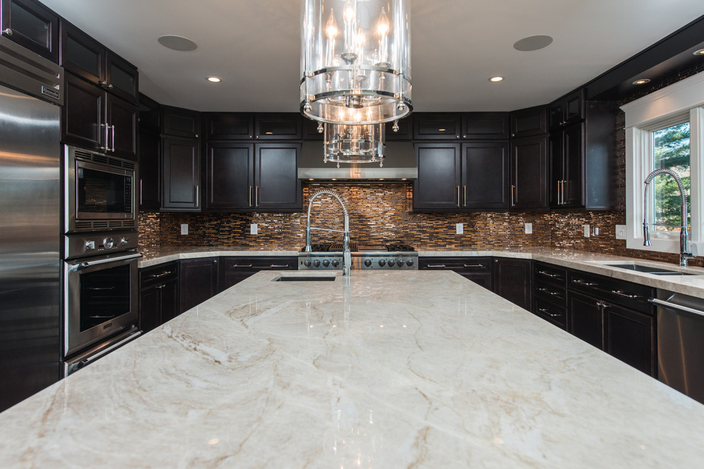black kitchen cabinets designed with Taj Mahal Quartzite