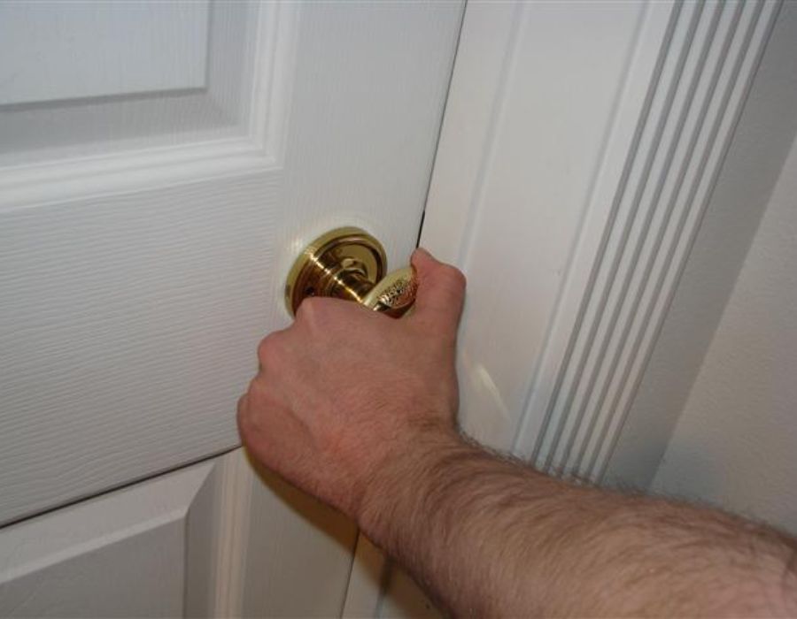 hand of a man trying to open the door