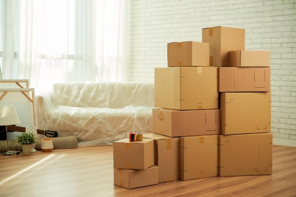 cardboard moving boxes in living room